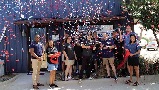 Auto shop celebrates grand reopening