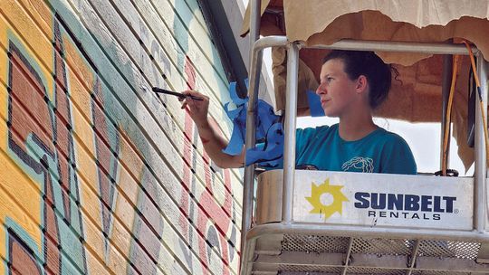 Muralist returns to Aubrey